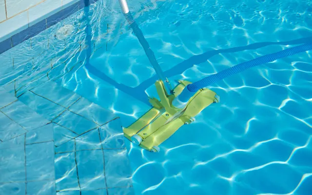 Outdoor swimming pool underwater cleaning